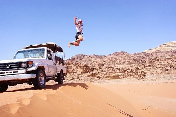 Half-Day Jeep Safari "Wadi Rum Highlights!" w/ Professional Bedouin Guide - Red dunes, sandboarding, and a choice of pace